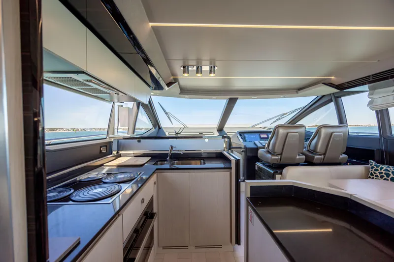 Slide: The Image of Luxurious interior of 2019 Azimut 66 FLY yacht with modern kitchen and helm station. - 49