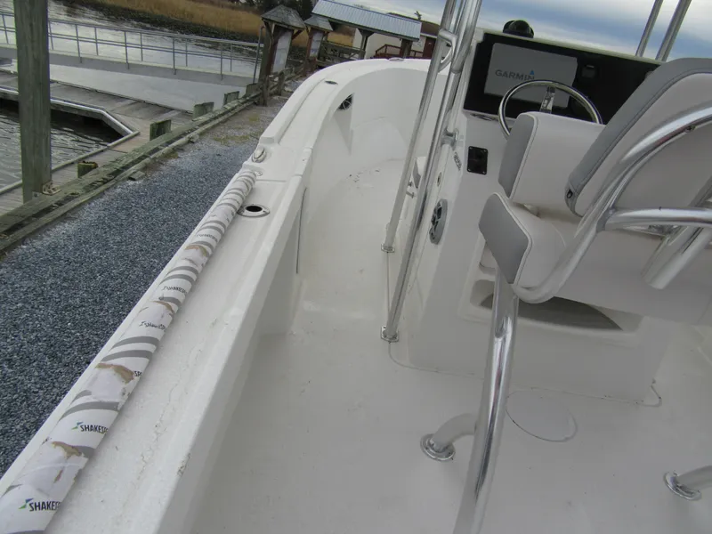 Slide: The Image of 2025 Parker 23SE Center Console boat interior with seating and steering wheel. - 12