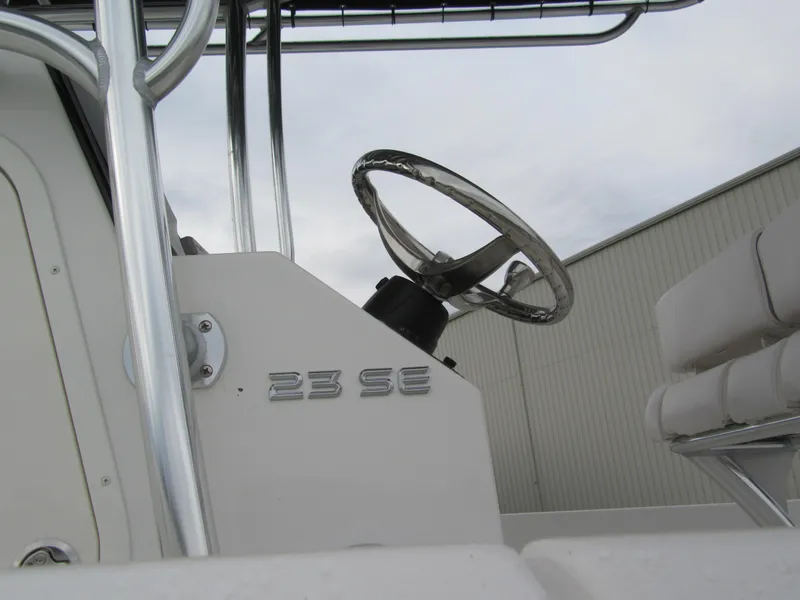 Slide: The Image of 2025 Parker 23SE Center Console boat steering wheel and seating detail. - 15