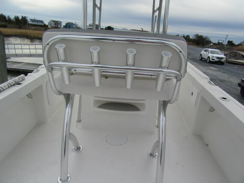 Slide: The Image of 2025 Parker 23SE Center Console boat interior with rod holders and seating. - 4