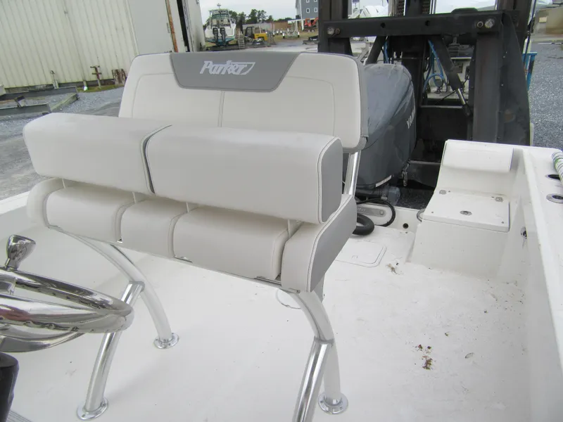Slide: The Image of 2025 Parker 23SE Center Console boat interior with seating and steering wheel. - 6