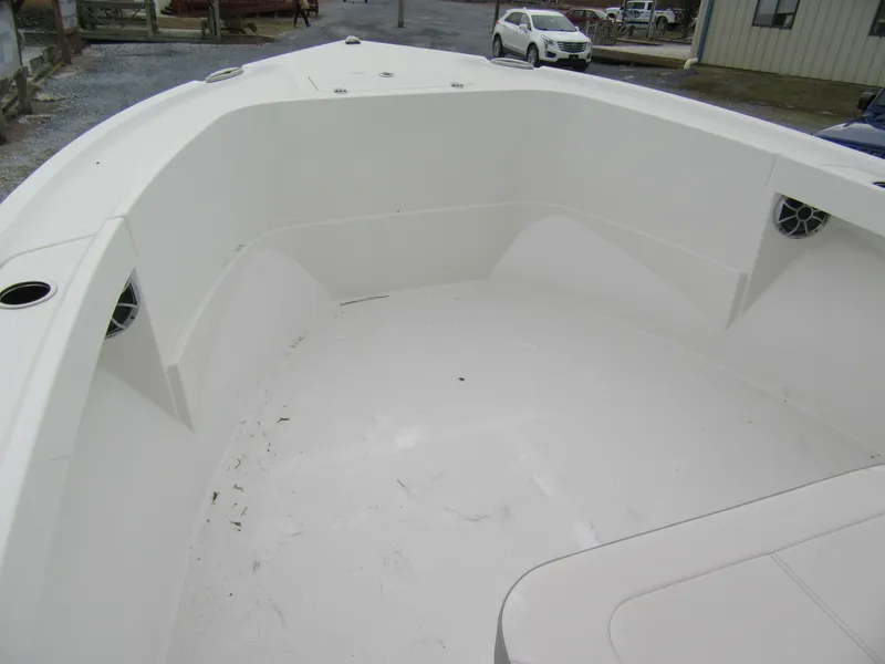 Slide: The Image of 2025 Parker 23SE Center Console boat interior, featuring spacious white deck and seating area. - 8