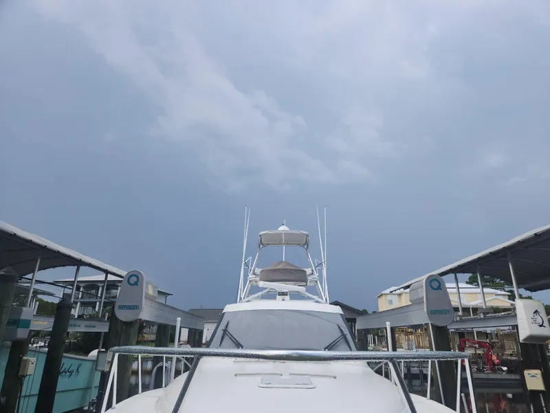 Slide: The Image of 2015 Jupiter 41 SB yacht docked under cloudy sky. - 12