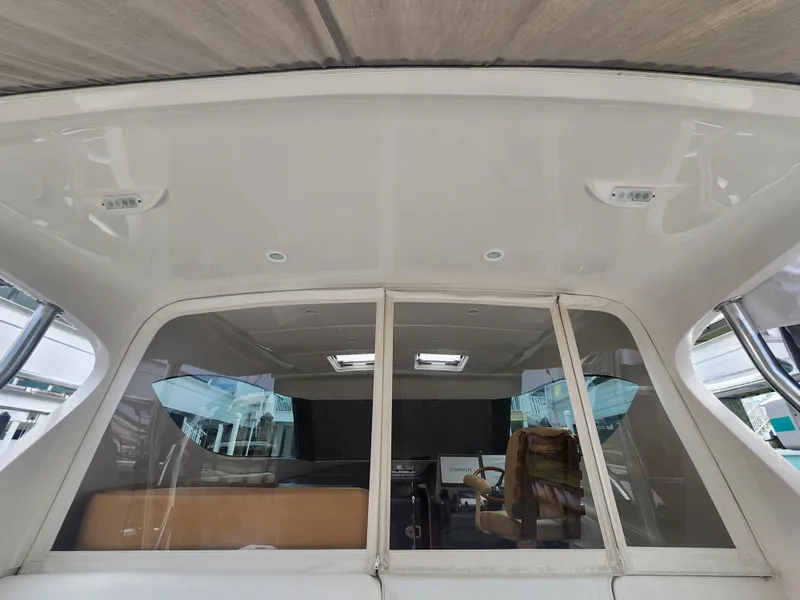 Slide: The Image of Interior view of 2015 Jupiter 41 SB yacht, featuring helm and seating area. - 21