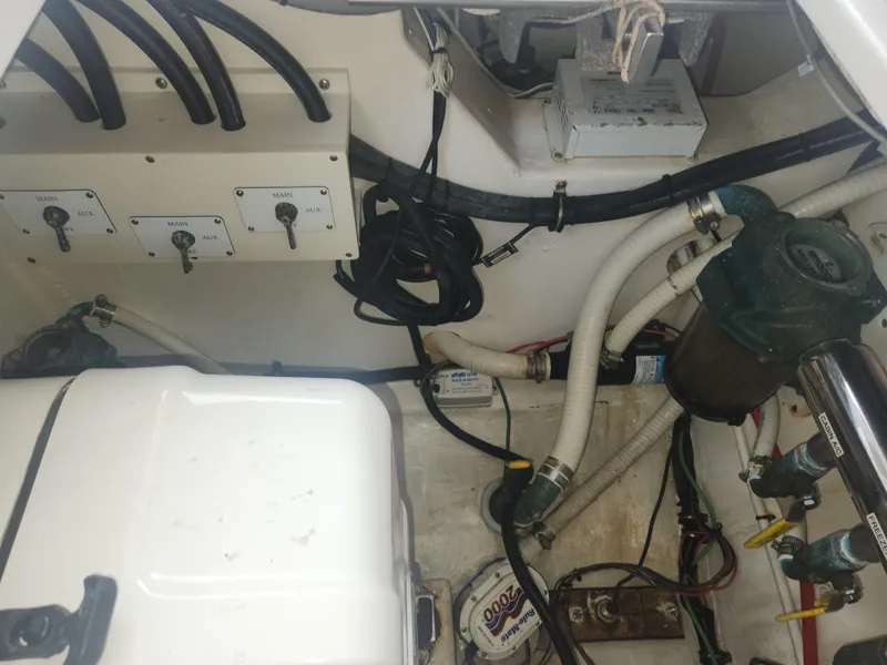 Slide: The Image of Engine compartment of a 2015 Jupiter 41 SB boat, showing wiring and mechanical components. - 24