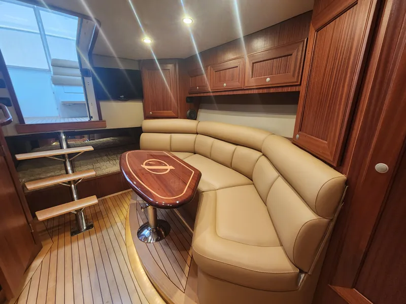 Slide: The Image of Luxurious interior of 2015 Jupiter 41 SB yacht with leather seating and wooden cabinetry. - 27