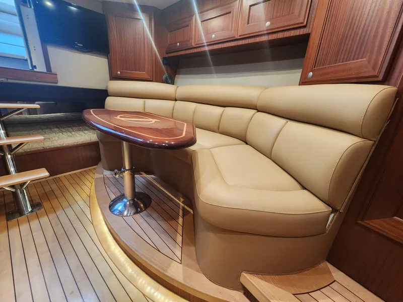 Slide: The Image of Luxurious interior of 2015 Jupiter 41 SB yacht with leather seating and wooden accents. - 30