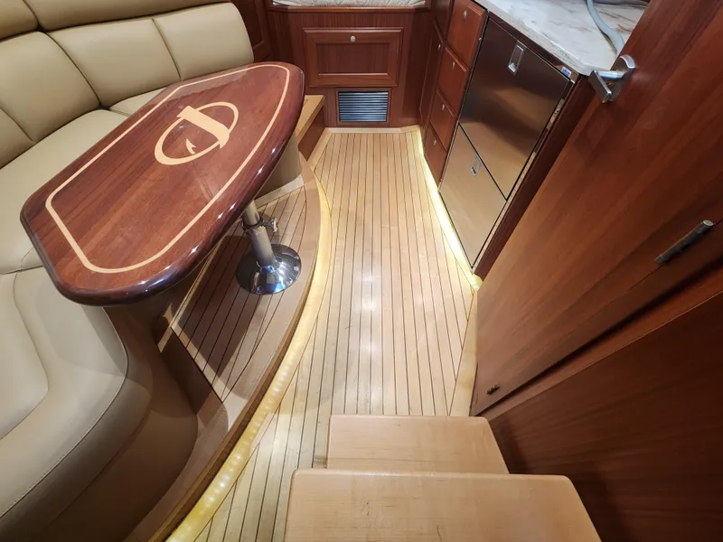 Slide: The Image of Luxurious interior of 2015 Jupiter 41 SB yacht with elegant wood finishes and seating. - 31