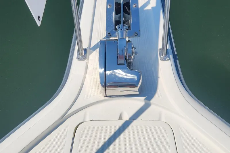 Slide: The Image of 1988 Tiara Yachts 2700 Open deck with shiny chrome winch and railing. - 22