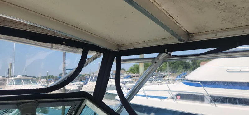 Slide: The Image of Interior view of 1988 Tiara Yachts 2700 Open, showcasing marina background. - 27