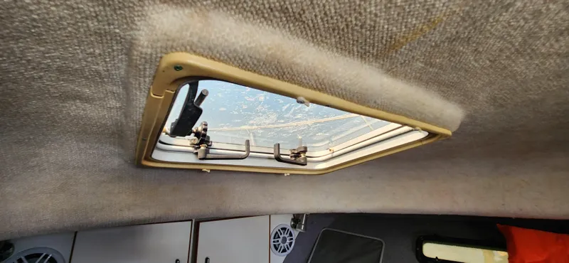 Slide: The Image of Interior view of 1988 Tiara Yachts 2700 Open, featuring a cabin skylight. - 33