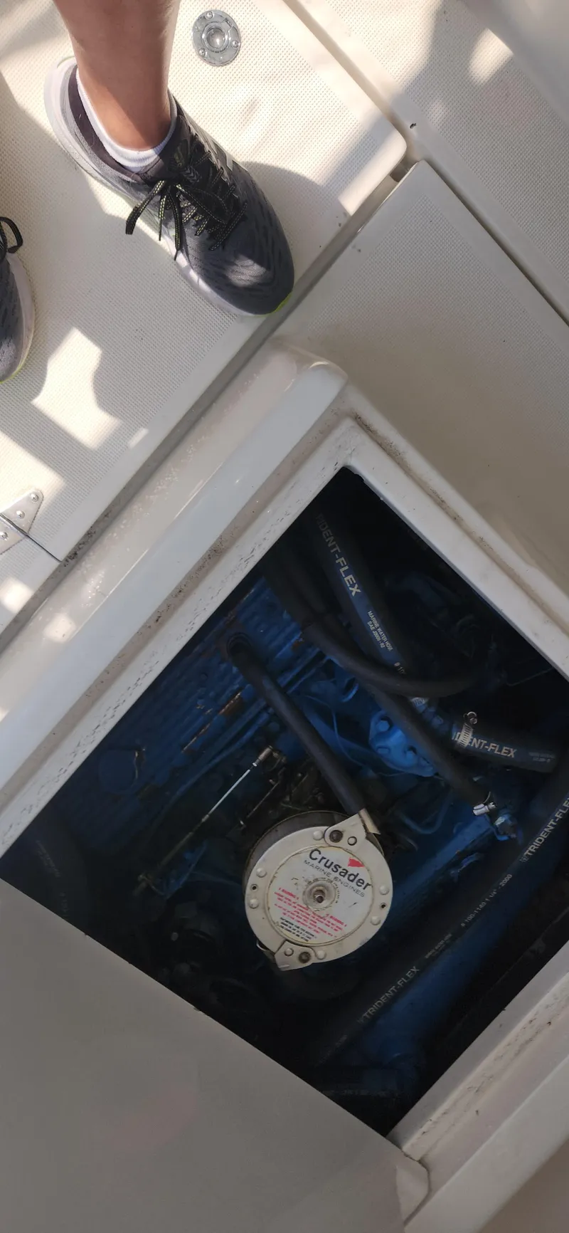 Slide: The Image of 1988 Tiara Yachts 2700 Open engine compartment with visible Crusader engine components. - 35