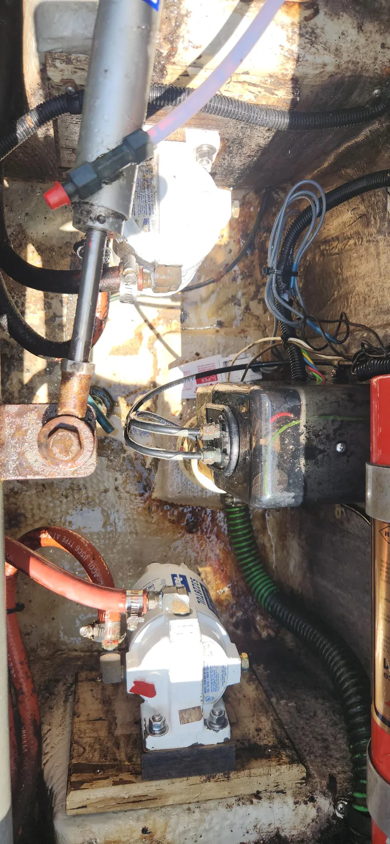 Slide: The Image of Engine compartment of a 1988 Tiara Yachts 2700 Open, showing mechanical components and wiring. - 38