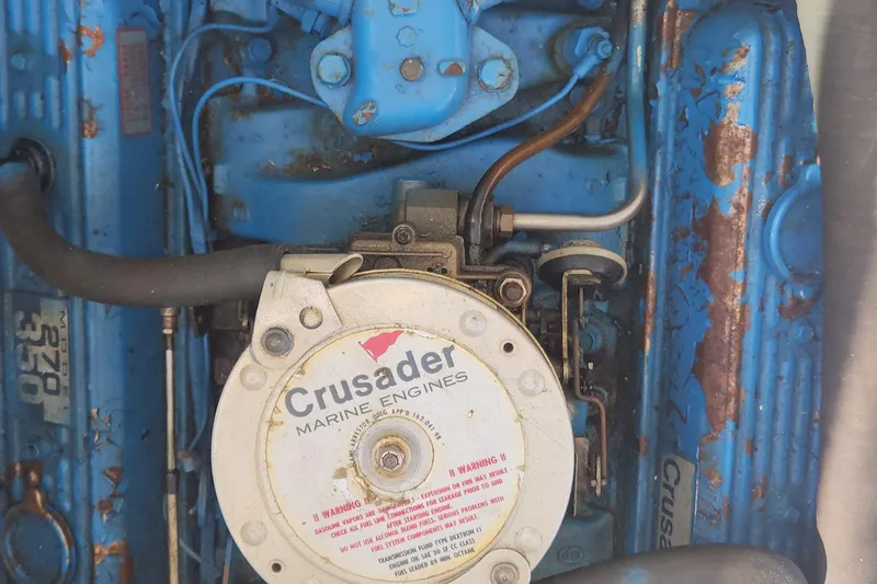 Slide: The Image of 1988 Tiara Yachts 2700 Open engine, featuring Crusader Marine Engines, with visible wear and rust. - 41