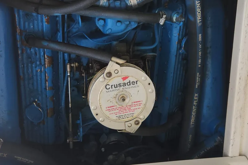 Slide: The Image of 1988 Tiara Yachts 2700 Open engine, featuring Crusader Marine Engines and Trident-Flex hoses. - 42