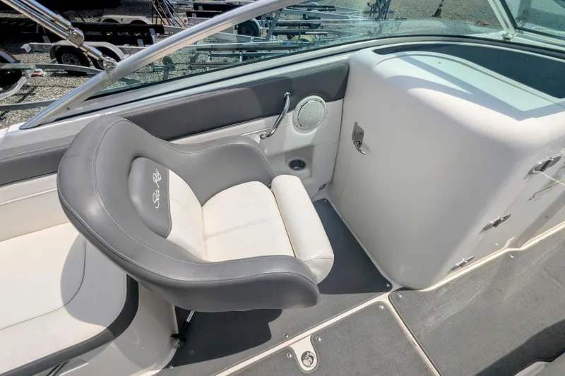Slide: The Image of 2011 Sea Ray 260 Sundeck interior with gray and white seating, sleek design. - 5