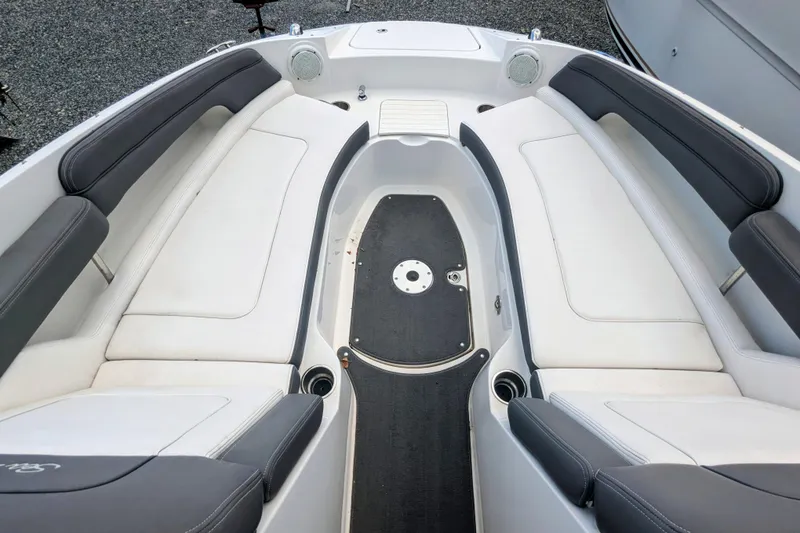 Slide: The Image of 2011 Sea Ray 260 Sundeck interior with white and gray seating, spacious layout. - 9