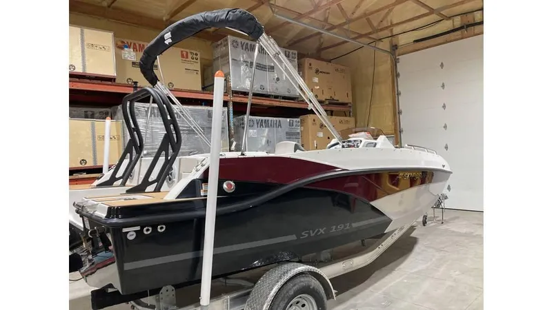 Slide: The Image of 2025 Starcraft SVX 191 OB boat in storage, featuring sleek design and modern amenities. - 3