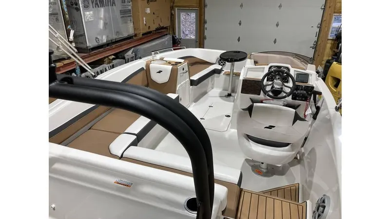 Slide: The Image of 2025 Starcraft SVX 191 OB boat interior with modern seating and steering console. - 5