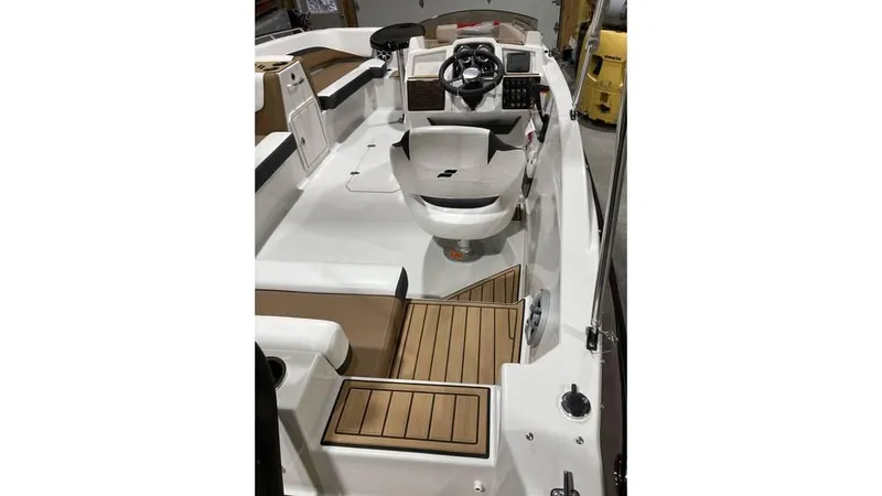 Slide: The Image of 2025 Starcraft SVX 191 OB boat interior with modern helm and seating. - 8