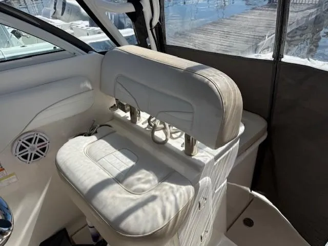 Slide: The Image of 2015 Wellcraft 290 Coastal boat interior with cushioned seating and speaker. - 8