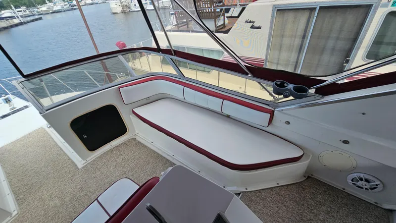 Slide: The Image of 1989 Carver 38 Santego boat interior with seating and cup holders. - 10