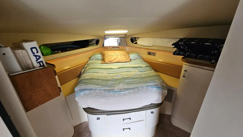 Slide: The Image of 1989 Carver 38 Santego cabin interior with cozy bed and storage. - 22
