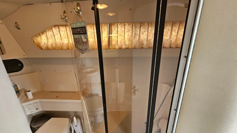 Slide: The Image of Bathroom interior of 1989 Carver 38 Santego yacht with shower and toilet. - 27