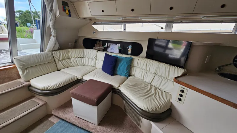 Slide: The Image of Interior of 1989 Carver 38 Santego yacht with cozy seating and modern amenities. - 17
