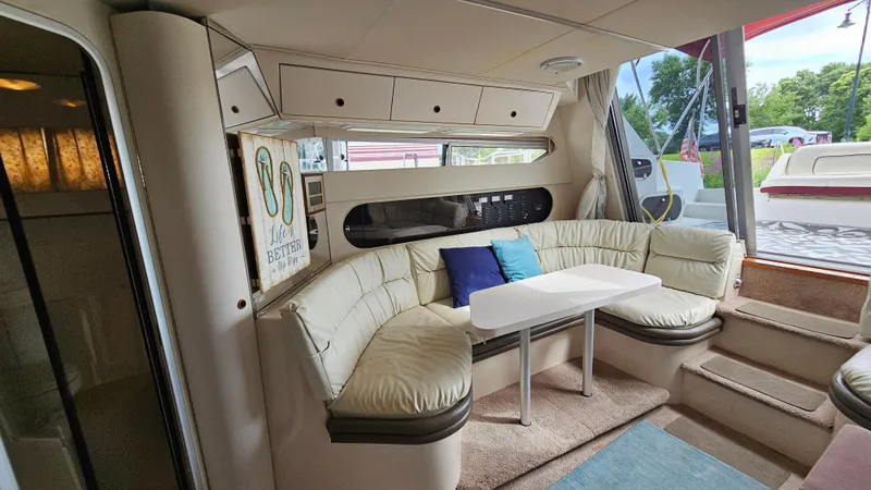 Slide: The Image of Interior of 1989 Carver 38 Santego yacht with cozy seating and table. - 18
