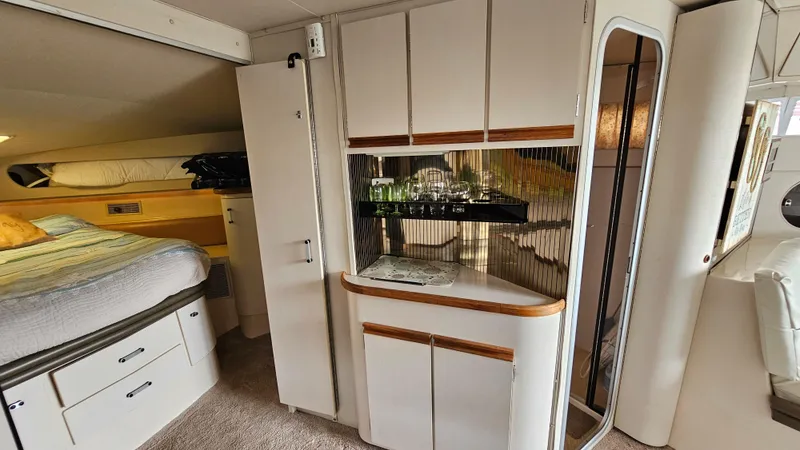 Slide: The Image of Interior of 1989 Carver 38 Santego yacht with cozy bedroom and stylish cabinetry. - 21
