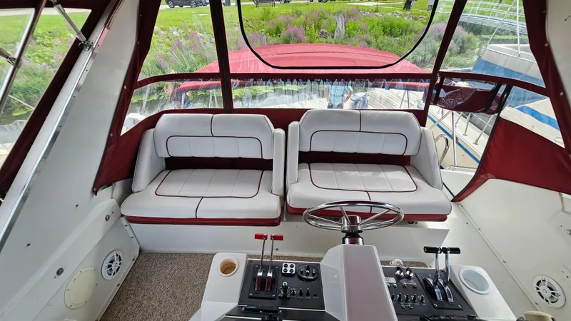 Slide: The Image of Interior view of 1989 Carver 38 Santego boat cockpit with dual seats and control panel. - 8