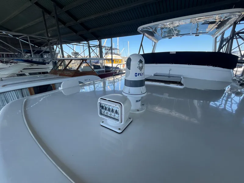 Slide: The Image of 2025 Helmsman Trawlers 43E Pilothouse yacht with radar and spotlight on deck. - 36