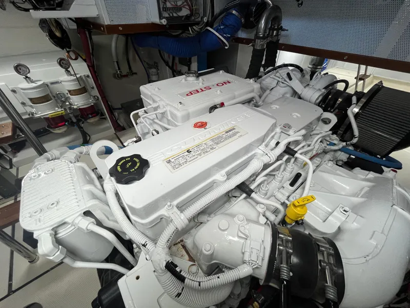 Slide: The Image of Engine room of 2025 Helmsman Trawlers 43E Pilothouse, showcasing detailed machinery components. - 44