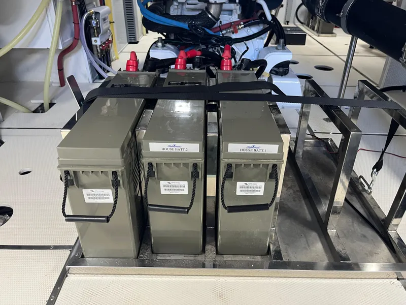 Slide: The Image of Batteries in the engine room of a 2025 Helmsman Trawlers 43E Pilothouse yacht. - 49