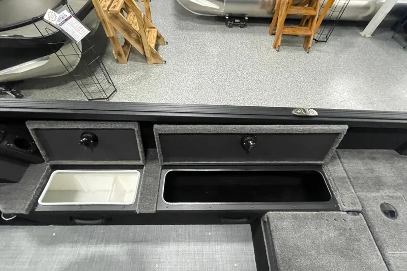 Slide: The Image of 2026 Alumacraft Competitor 195X Sport boat storage compartments and interior view. - 14