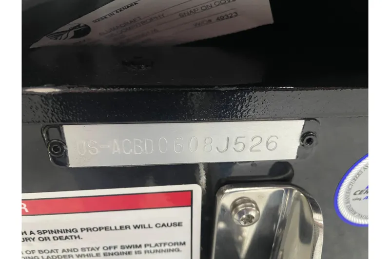 Slide: The Image of 2026 Alumacraft Competitor 195X Sport boat identification plate with warning label. - 16