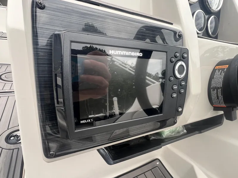 Slide: The Image of Humminbird Helix 5 fish finder on 2022 Starcraft SVX 191 OB boat dashboard. - 13