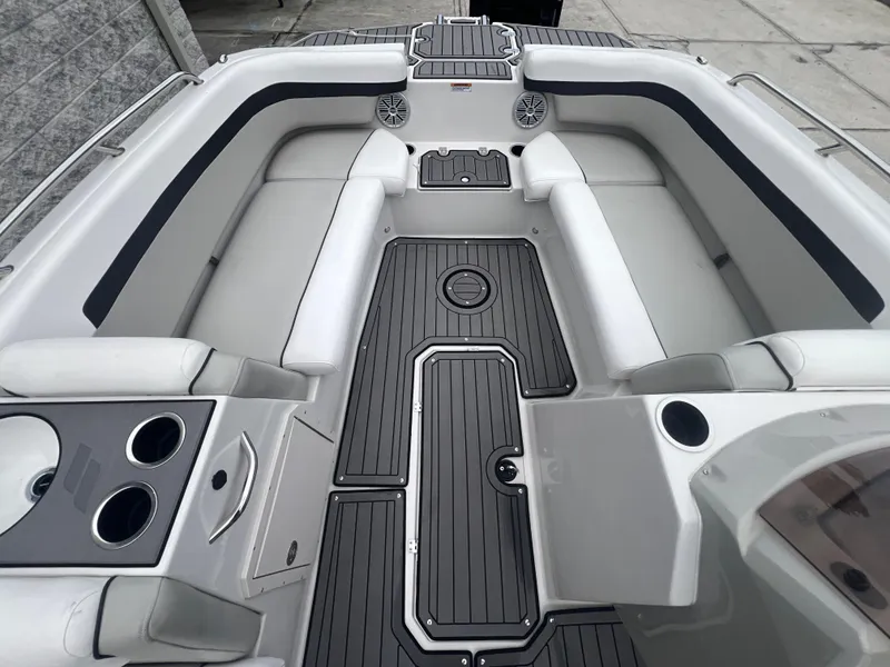 Slide: The Image of 2022 Starcraft SVX 191 OB boat interior with gray seating and black flooring. - 16