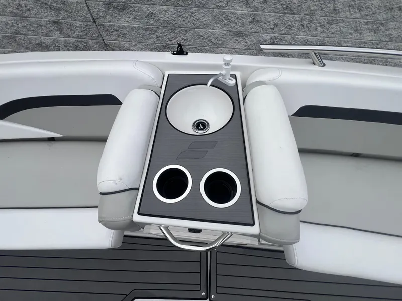 Slide: The Image of 2022 Starcraft SVX 191 OB boat sink and cup holders on deck. - 20
