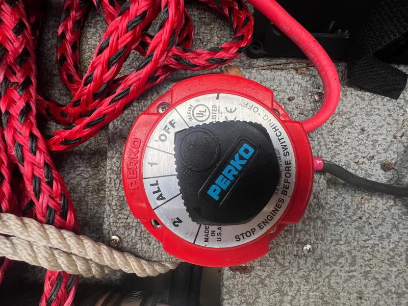 Slide: The Image of Red Perko marine battery switch with ropes, Starcraft SVX 191 OB 2022. - 25