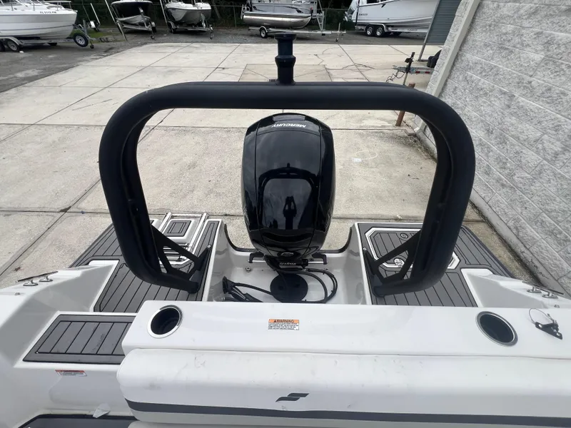 Slide: The Image of 2022 Starcraft SVX 191 OB boat with Mercury outboard motor, docked in a marina. - 26