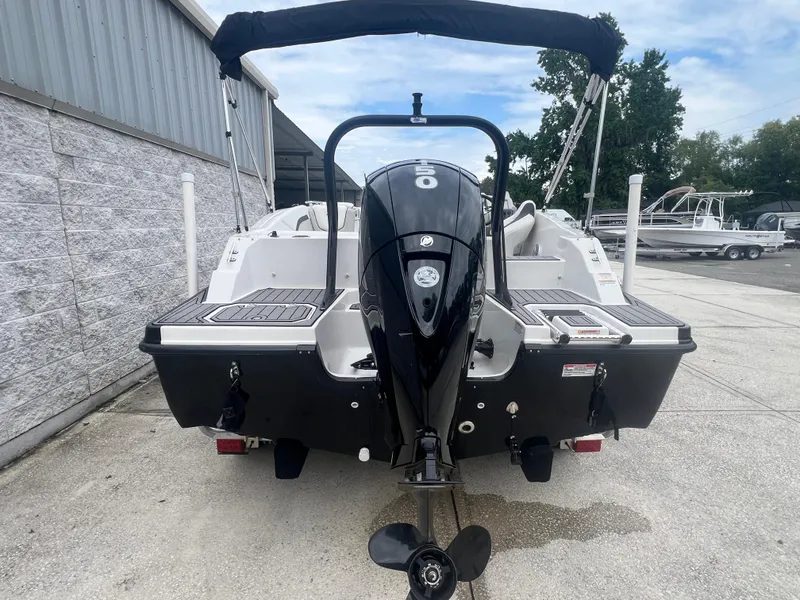 Slide: The Image of 2022 Starcraft SVX 191 OB boat with outboard motor, docked outdoors. - 4