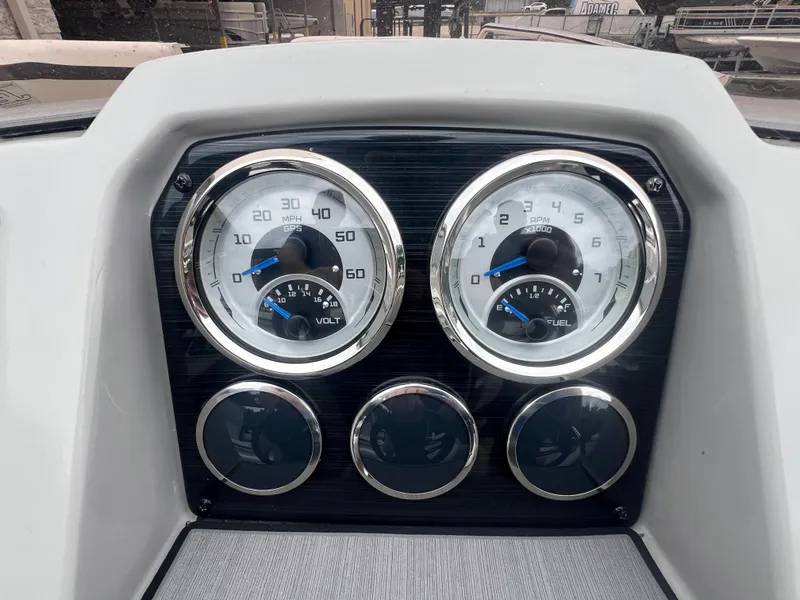 Slide: The Image of Dashboard of 2022 Starcraft SVX 191 OB boat with speedometer and fuel gauge. - 9