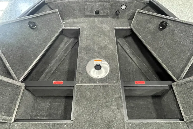 Slide: The Image of 2026 Alumacraft Voyageur 175 Tiller boat interior with open storage compartments. - 7