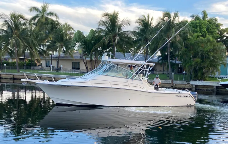 The Image of 2007 Grady-White Express 360 boat cruising on a calm waterway with palm trees in the background. - 0