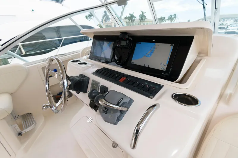 Slide: The Image of 2007 Grady-White Express 360 helm with navigation screens and controls. - 11