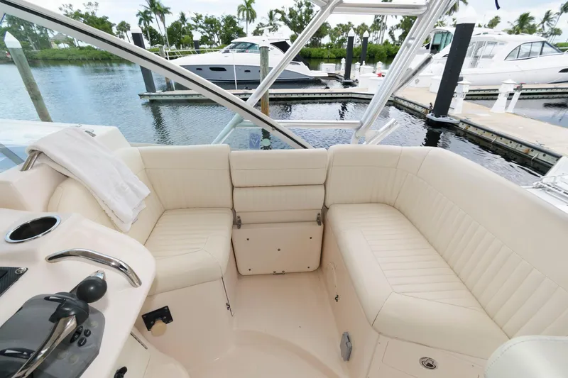 Slide: The Image of 2007 Grady-White Express 360 boat interior with white seating, docked at marina. - 15