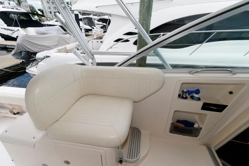 Slide: The Image of 2007 Grady-White Express 360 boat interior with white seating and storage compartments. - 16