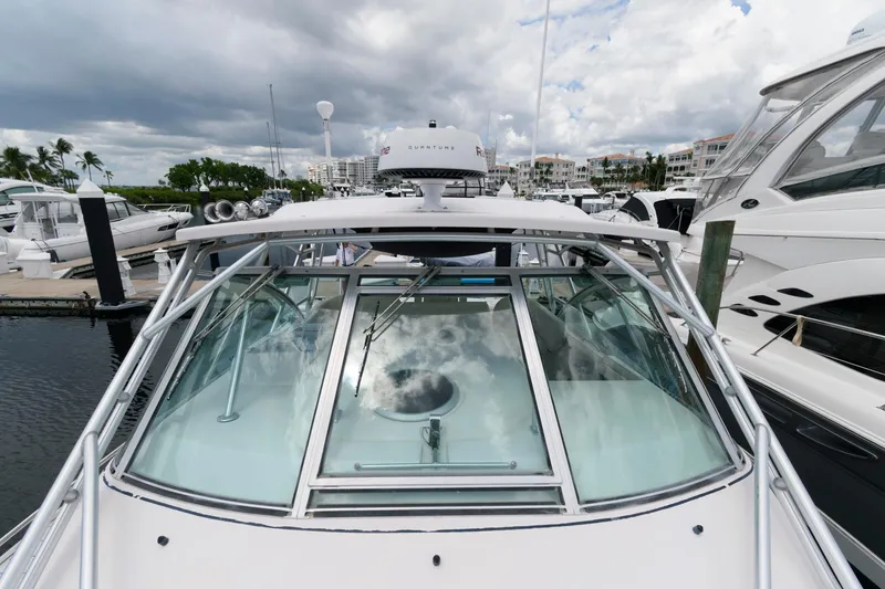 Slide: The Image of 2007 Grady-White Express 360 boat docked at marina under cloudy sky. - 19